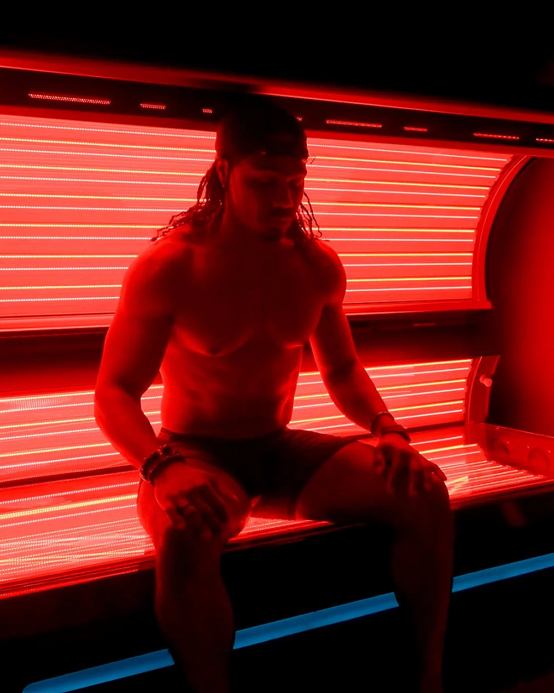 Athlete preparing for Red Light Pro-Bed session at REDSOL Wellness Club in League City TX