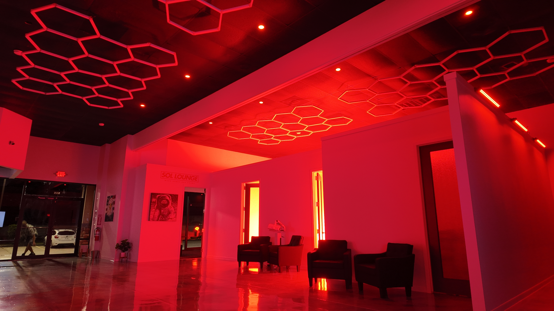 REDSOL Wellness Club red light therapy room with ambient red lighting in League City Texas